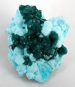 Dioptase on Chrysocolla, Otjikotu, Kunene Region, Namibia. 6.8 × 5.5 × 4.5 cm