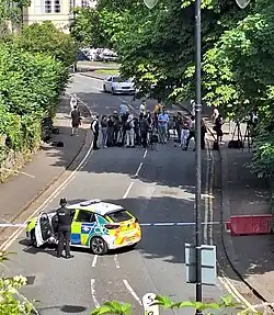 Police blocking access to the bridge while members of the media await a police statement on 11 July 2024