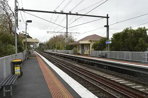 Collingwood station Platform 2 looking north, showing the two station buildings on each platform