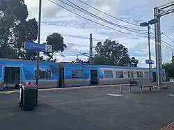 Comeng 561M awaits to begin a Frankston via Southern Cross-Flinders Street service at Werribee station Platform 1.