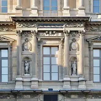 Renaissance medallion with marble plaques on the north facade of the Cour Carrée of the Louvre Palace, designed by Pierre Lescot, 16th century[11]