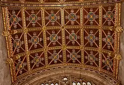The carved, painted and gilded barrel-vaulted ceiling