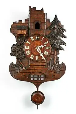 Castle-like ruins clock case with echo. There is a second smaller cuckoo partially visible in the sentry box at left, c. 1890 (Deutsches Uhrenmuseum, Inv. 1995–638).