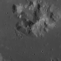 Central peak complex of Damer, showing abundant hollows