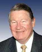 U.S. Congressman Duke Cunningham — In November 2005 he resigned after pleading guilty to federal charges of conspiracy to commit bribery, mail fraud, wire fraud, and tax evasion. He was sentenced to over eight years in prison and an order to pay $1.8 million in restitution.