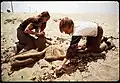 Two eighth grade students picking up the beach during recess, 1972