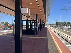 Train station platform with shelter overhead