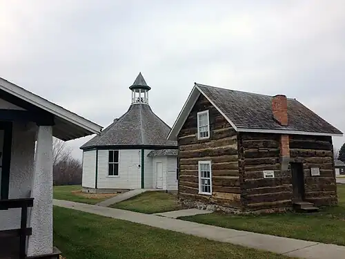 Engebrecht Peterson log cabin and 1898 District 13 School