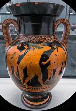 Three bearded men dance energetically, holding wine-cups.