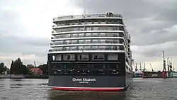 With the help of harbour pilots, its Azipod propulsion, and stern thrusters, the ship moves into the correct position.