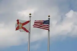 The Florida flag flying beside the United States flag