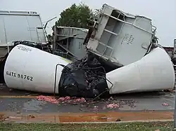 A crushed tank car involved in the derailment