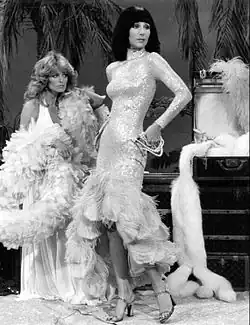 Farrah Fawcett and Cher in 1976. From the 1960s up to the 1980s, women aimed to look skinny. Tanned skin also became popular.[174]