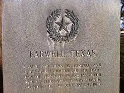 Monument in Farwell, Texas, noting the Farwell brothers as receiving the land which became the XIT in exchange for constructing the Texas State Capitol building