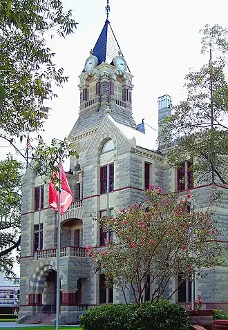 The Fayette County Courthouse in La Grange, between Houston and Austin, was finished in 1891. The Romanesque Revival building uses four types of native Texas stone to detail the exterior.