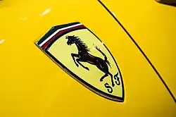 Close-up of a shield-shaped Ferrari badge