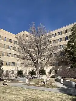 An outside photo from 2023 of the Fitzsimons Building showing the State Anatomical Board Body Donor Garden in the southeast corner of the building.
