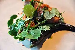 Fried bacon with ramsons and grilled cucumber