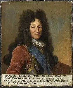 Half-length portrait of a clean-shaven man wearing a high wig and armour.