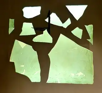 Fragment of a Roman window glass plate dated to 1st to 4th century CE. Note the obvious curvature; this is not a flat pane