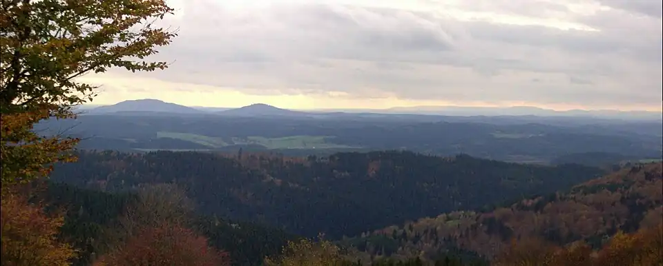 View from the Simmersberg (781 m) in the Thuringian Highland of the Gleichberge, 24 km away. Right rear: the Rhön and the Kreuzberg ({{Subst:Formatnum:927.8}} m), 67 km away. Centre, half right: the Ratscher Bergsee lake, 7 km away