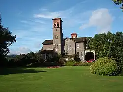 an Italianate house with a tall bell tower