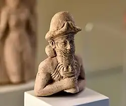 a statuette in a museum display