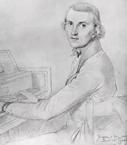 young man, clean shaven, in early 19th-century clothes, sitting at a piano keyboard and looking towards the viewer
