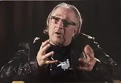 Lawrence Grossberg gesturing in conversation