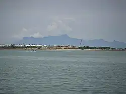 The mountain as seen from George Town, Penang, 42 km (25 mi) southwest.
