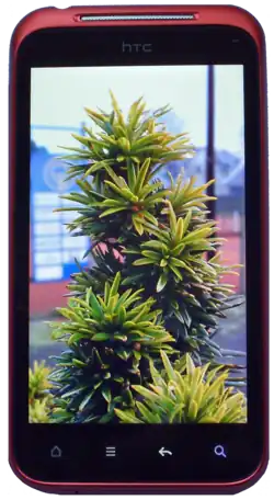 The HTC Incredible S smartphone displaying the device's default home screen.