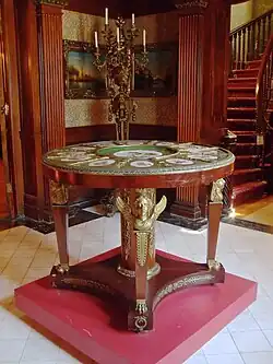 Empire style table with caryatids en gaine supported by bare feet, early 19th century, wood, metal, glass, pigment, and porcelain, Musée Dufresne-Nincheri, Montreal, Canada