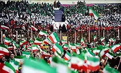 Supporters of Hassan Rouhani with Islamic Republican flags plastered.