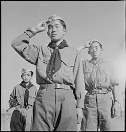 Boy Scouts conducting a morning flag raising ceremony at the Heart Mountain Relocation Center on June 5, 1943