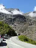 Mount Moir above cars waiting at Homer Tunnel