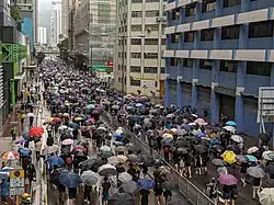 Participants in the rally marched through Yeung Uk Road in the rain, occupying all traffic lanes.