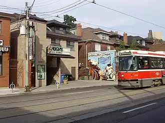 Three-storey house built with grey-brown bricks, converted into a music venue