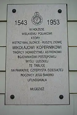 Plaque in tribute to Nicolaus Copernicus on the façade of the Second General High School