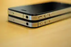 An iPhone 4 on top of an iPhone 4s.