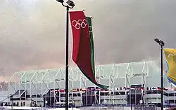 Exterior of the Olympic Arena at Lake Placid with banners featuring the Olympic Rings
