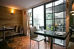 Two tables are located inside, with several more set up outside.