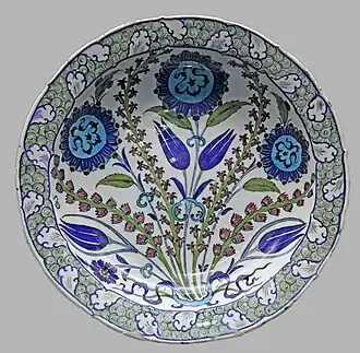 Dish with cloud scrolls that are similar to those on the lamp, and a rock and wave border, c. 1550