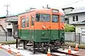The cab end of car KuMoHa 169 27 preserved next to Shimoyoshida Station on the Fujikyuko Line in Yamanashi Prefecture