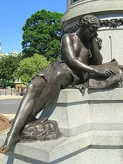 One of three sculptures on the pedestal