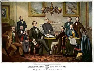 Six men sitting around a table looking forward, one man, Robert E. Lee, is standing up pointing toward a map