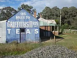 Advertising sign on wall of the former post office and store facing the Main Southern railway line at Jerrawa, April 2021.