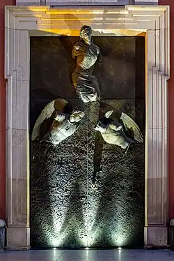 Church doors by Igor Mitoraj at night