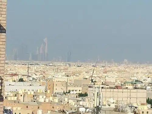 Jleeb's Skyline.The tower in back is Al Hamra Tower