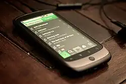 Image 26A smartphone displaying playlists on Spotify, 2010. The streaming service became a dominant and redefining platform for music consumption through the decade. (from Album era)