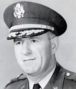 1966 black and white head and shoulders photo of Brigadier John C. Baker in dress uniform and cap, facing slightly to his right